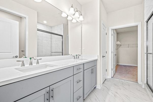 Bathroom, Dual Sink Vanities, Glass Shower, Interior, Marble, Recessed Lighting, Walk-in Closets