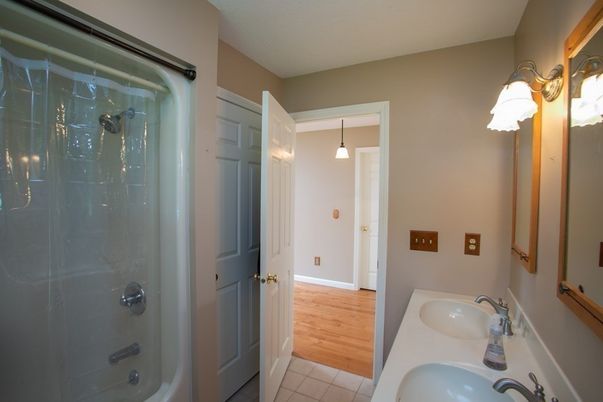 Bathroom, Dual Sink Vanities, Glass Shower, Interior, Pendant Lights, Wood Texture Flooring
