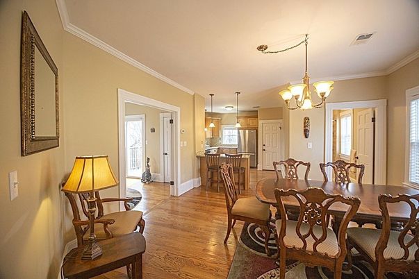 Chandelier, Dining room, Interior, Kitchen, Pendant Lights, Stainless Steel Appliances, Wood Texture Flooring
