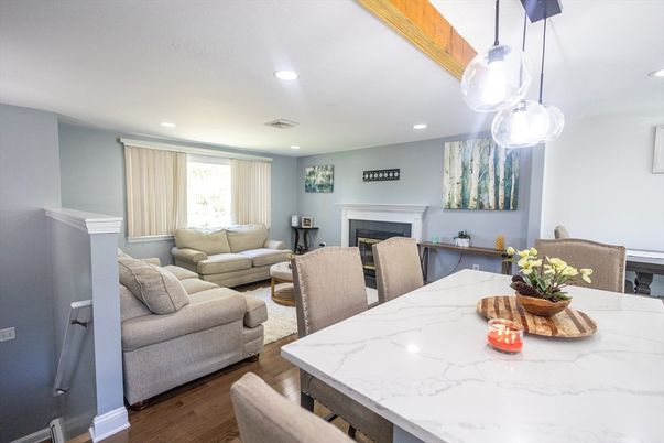 Dining room, Fireplace, Interior, Living room, Pendant Lights, Recessed Lighting, Wood Texture Flooring