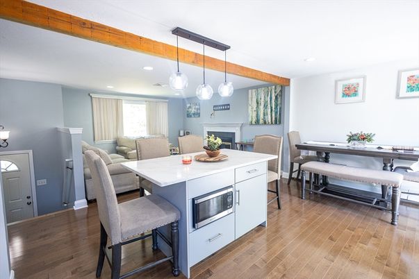 Dining room, Fireplace, Interior, Pendant Lights, Recessed Lighting, Wooden Beams, Wood Texture Flooring