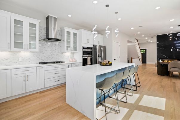 Interior, Kitchen, Marble Walls, Pendant Lights, Recessed Lighting, Stainless Steel Appliances, Wood Texture Flooring