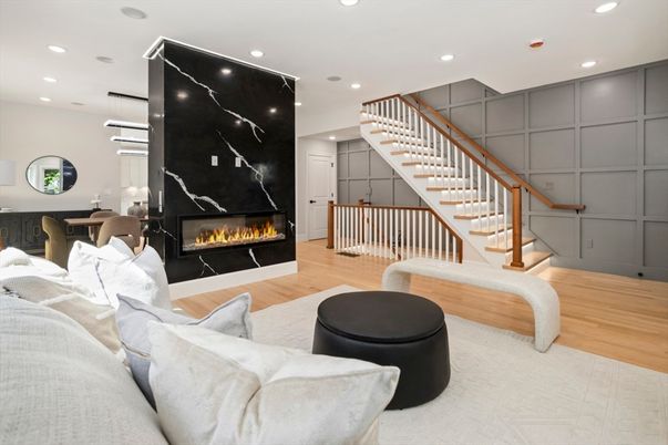 Fireplace, Interior, Living room, Marble Walls, Pendant Lights, Recessed Lighting, Wood Texture Flooring