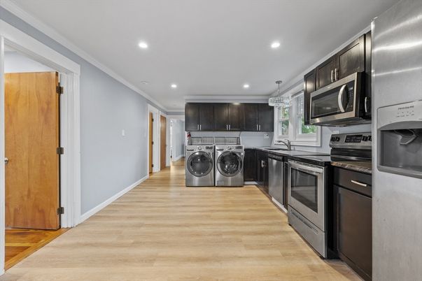 Interior, Kitchen, Recessed Lighting, Washer, Wood Texture Flooring