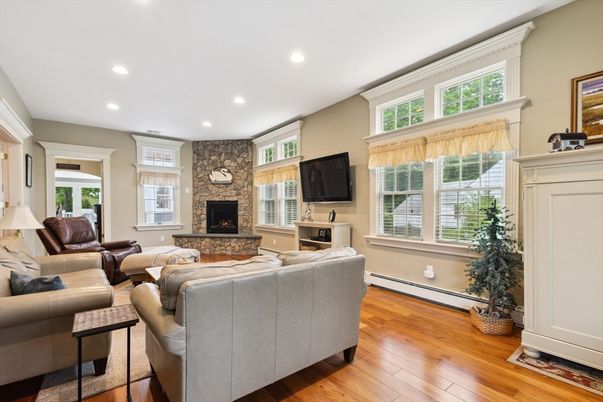 Fireplace, Interior, Living room, Recessed Lighting, Stone Walls, Wood Texture Flooring