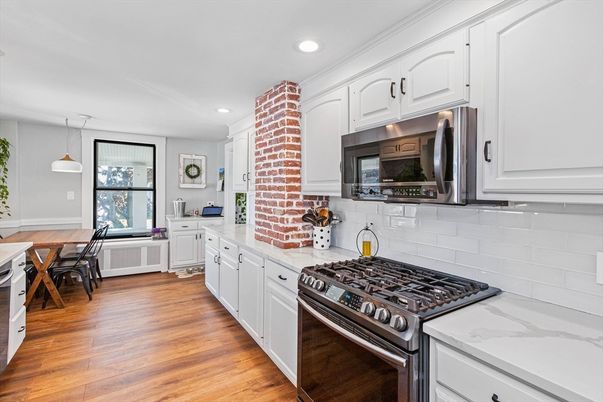 Dining room, Interior, Kitchen, Pendant Lights, Recessed Lighting, Stainless Steel Appliances, Wood Texture Flooring
