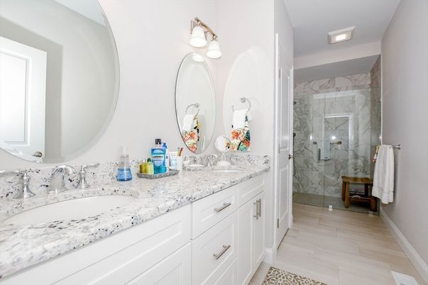 Bathroom, Dual Sink Vanities, Glass Shower, Interior, Marble Walls, Recessed Lighting
