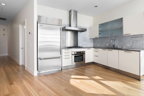 Interior, Kitchen, Marble Walls, Recessed Lighting, Stainless Steel Appliances, Wood Texture Flooring