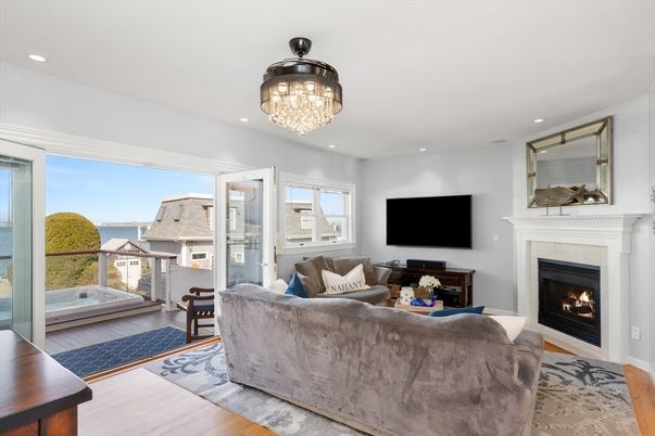 Chandelier, Fireplace, Interior, Living room, Recessed Lighting, Water, Wood Texture Flooring