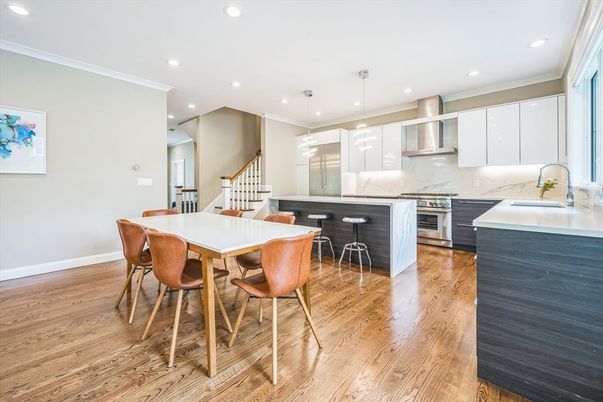 Dining room, Interior, Kitchen, Marble Walls, Pendant Lights, Recessed Lighting, Stainless Steel Appliances, Wood Texture Flooring