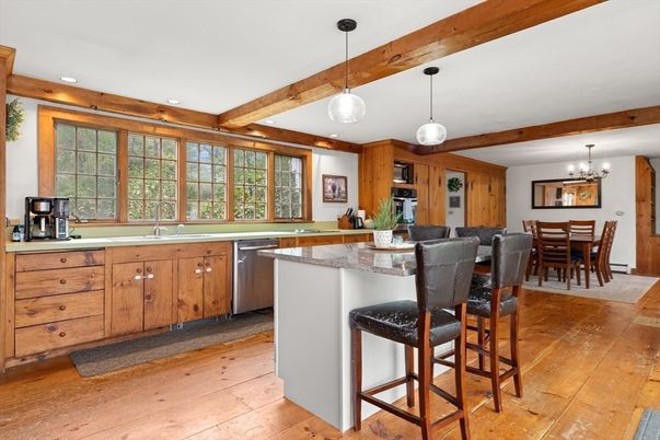 Chandelier, Dining room, Interior, Kitchen, Pendant Lights, Recessed Lighting, Stainless Steel Appliances, Wooden Beams, Wood Texture Flooring