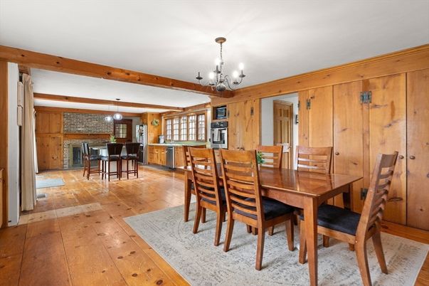 Chandelier, Dining room, Fireplace, Interior, Kitchen, Pendant Lights, Stone Walls, Wooden Beams, Wood Texture Flooring