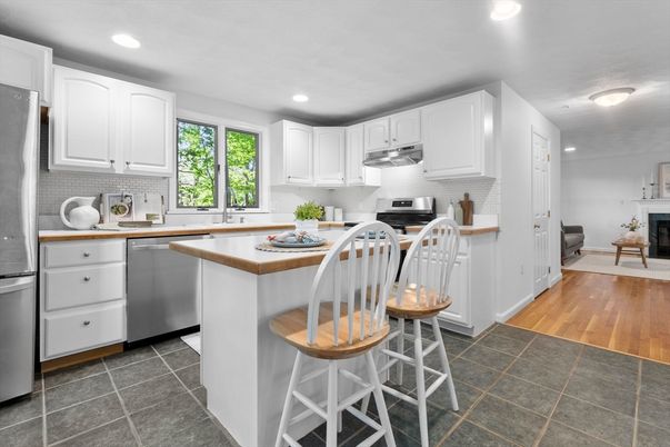Fireplace, Interior, Kitchen, Recessed Lighting, Stainless Steel Appliances, Wood Texture Flooring
