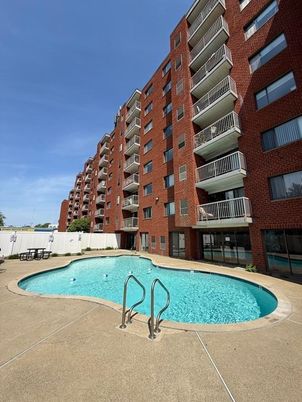 Exterior, Facade, Brick Facade, Pool, Condo Building