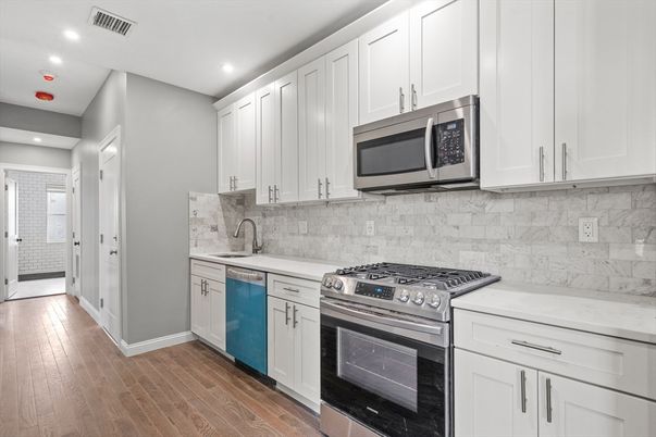 Interior, Kitchen, Recessed Lighting, Stainless Steel Appliances, Wood Texture Flooring
