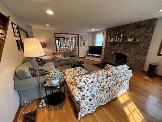 Fireplace, Interior, Living room, Recessed Lighting, Stone Walls, Wood Texture Flooring
