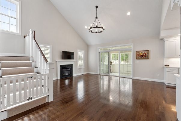 Chandelier, Empty room, Fireplace, Interior, Pendant Lights, Recessed Lighting, Wood Texture Flooring