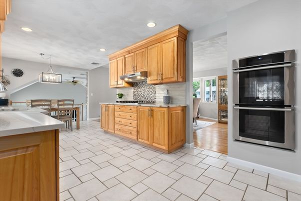 Dining room, Interior, Kitchen, Pendant Lights, Recessed Lighting, Stainless Steel Appliances, Wood Texture Flooring