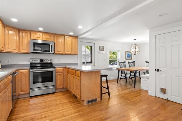 Dining room, Interior, Kitchen, Pendant Lights, Recessed Lighting, Stainless Steel Appliances, Wood Texture Flooring