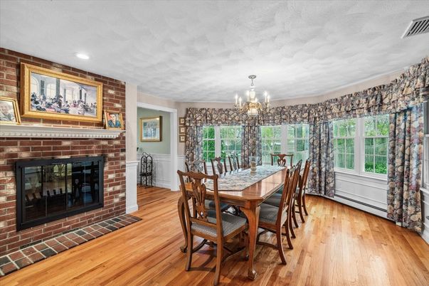 Chandelier, Dining room, Fireplace, Interior, Recessed Lighting, Stone Walls, Wood Texture Flooring