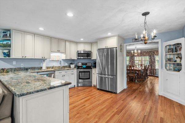 Chandelier, Dining room, Interior, Kitchen, Recessed Lighting, Stainless Steel Appliances, Wood Texture Flooring