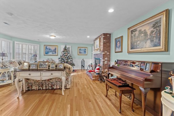 Fireplace, Interior, Living room, Piano, Recessed Lighting, Wood Texture Flooring