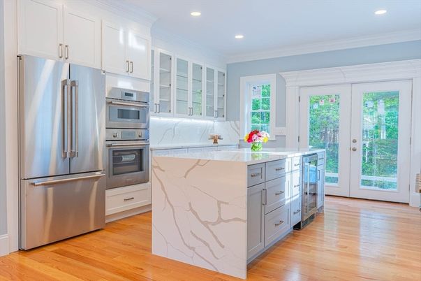 Interior, Kitchen, Marble Walls, Recessed Lighting, Stainless Steel Appliances, Wood Texture Flooring