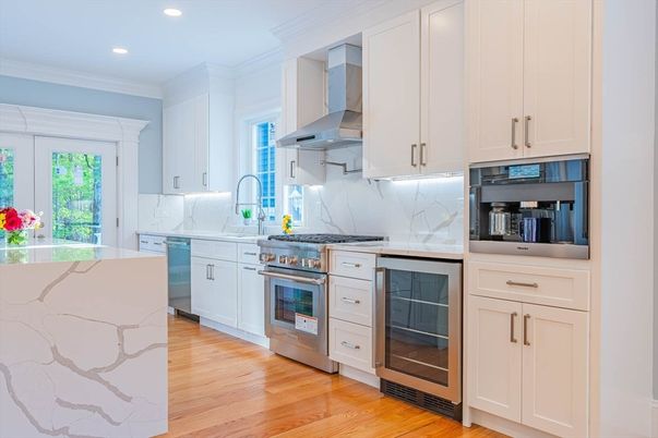 Interior, Kitchen, Marble Walls, Recessed Lighting, Stainless Steel Appliances, Wood Texture Flooring