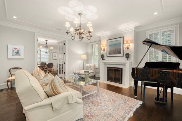 Chandelier, Dining room, Fireplace, Interior, Living room, Piano, Recessed Lighting, Wood Texture Flooring