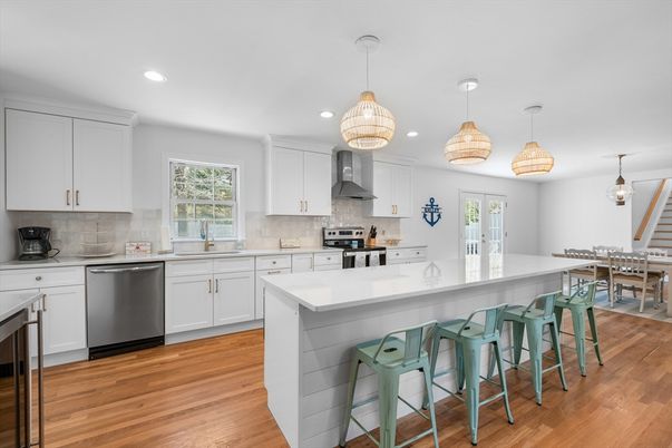 Dining room, Interior, Kitchen, Pendant Lights, Recessed Lighting, Stainless Steel Appliances, Wood Texture Flooring