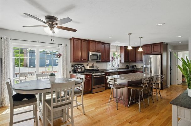 Dining room, Interior, Kitchen, Pendant Lights, Recessed Lighting, Stainless Steel Appliances, Wood Texture Flooring