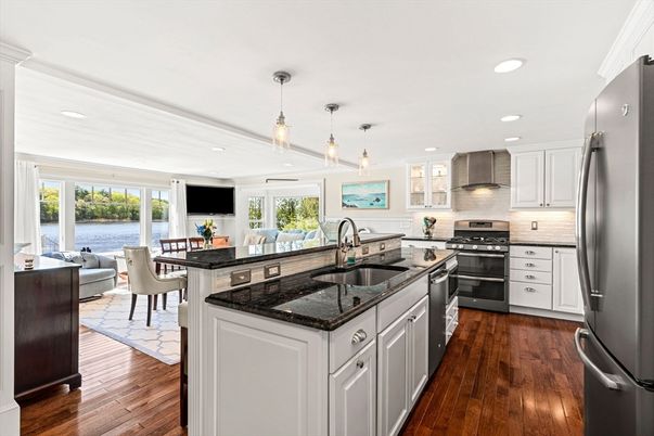 Dining room, Interior, Kitchen, Living room, Pendant Lights, Recessed Lighting, Stainless Steel Appliances, Water, Wood Texture Flooring