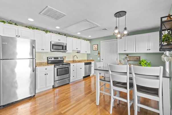 Dining room, Interior, Kitchen, Pendant Lights, Recessed Lighting, Stainless Steel Appliances, Wood Texture Flooring
