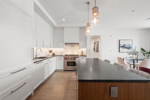 Dining room, Interior, Kitchen, Pendant Lights, Recessed Lighting, Stainless Steel Appliances, Wood Texture Flooring