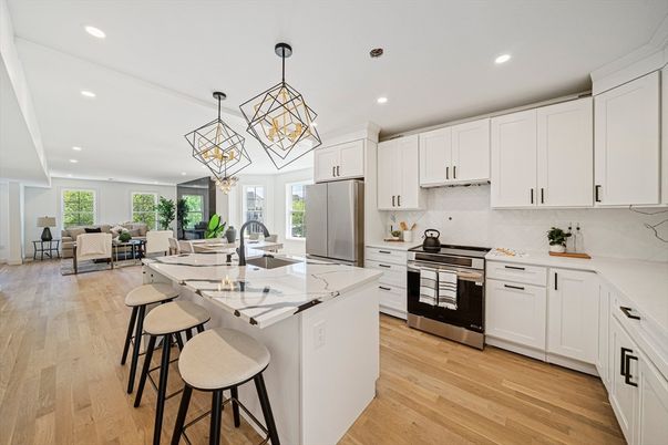 Chandelier, Dining room, Interior, Kitchen, Living room, Pendant Lights, Recessed Lighting, Stainless Steel Appliances, Wood Texture Flooring