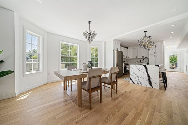 Chandelier, Dining room, Interior, Kitchen, Marble Walls, Pendant Lights, Recessed Lighting, Stainless Steel Appliances, Wood Texture Flooring