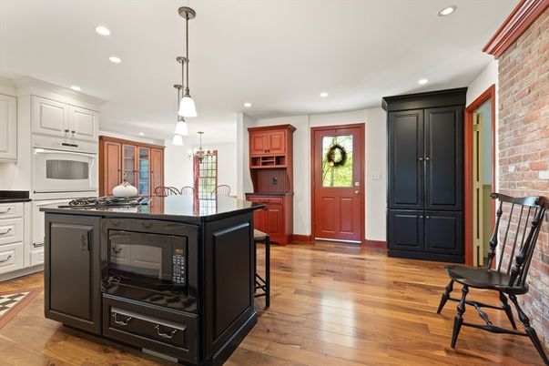 Interior, Kitchen, Pendant Lights, Recessed Lighting, Stainless Steel Appliances, Stone Walls, Wood Texture Flooring
