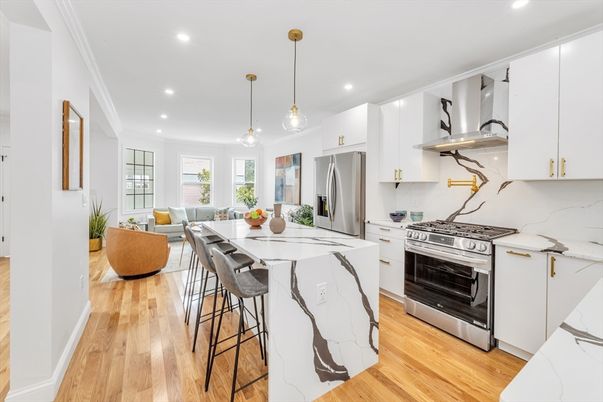 Interior, Kitchen, Living room, Marble Walls, Pendant Lights, Recessed Lighting, Stainless Steel Appliances, Wood Texture Flooring