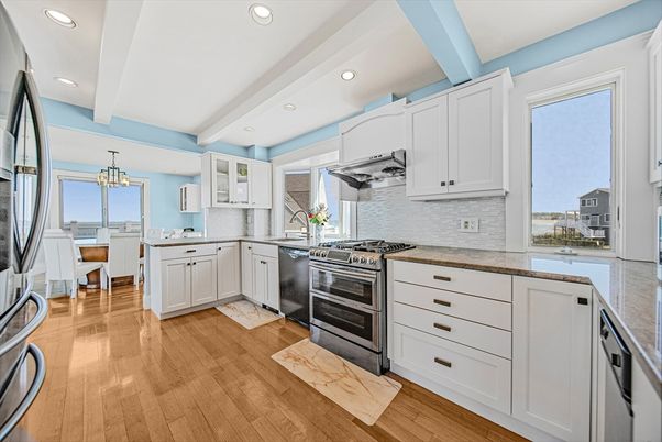 Chandelier, Dining room, Interior, Kitchen, Recessed Lighting, Stainless Steel Appliances, Wood Texture Flooring