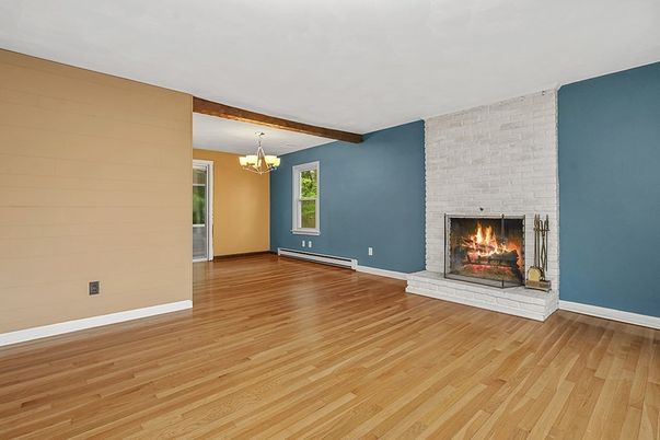 Chandelier, Empty room, Fireplace, Interior, Stone Walls, Wooden Beams, Wood Texture Flooring