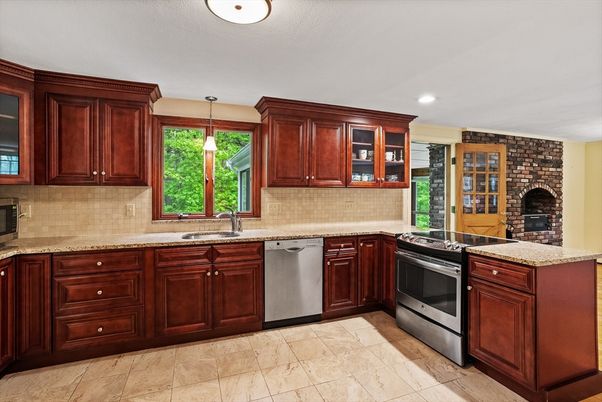 Fireplace, Interior, Kitchen, Pendant Lights, Recessed Lighting, Stainless Steel Appliances, Stone Walls