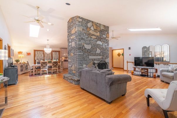 Chandelier, Dining room, Fireplace, Interior, Living room, Recessed Lighting, Stone Walls, Wood Texture Flooring