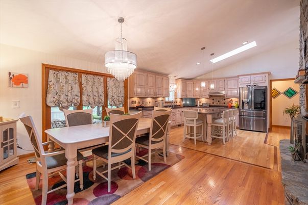 Chandelier, Dining room, Interior, Kitchen, Pendant Lights, Recessed Lighting, Stainless Steel Appliances, Wood Texture Flooring