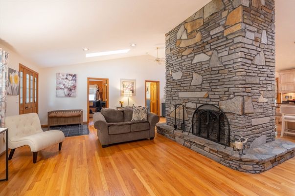 Fireplace, Interior, Living room, Recessed Lighting, Stone Walls, Wood Texture Flooring