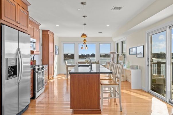Dining room, Interior, Kitchen, Pendant Lights, Recessed Lighting, Stainless Steel Appliances, Wood Texture Flooring