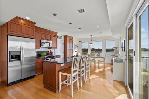 Dining room, Interior, Kitchen, Pendant Lights, Recessed Lighting, Stainless Steel Appliances, Water, Wood Texture Flooring
