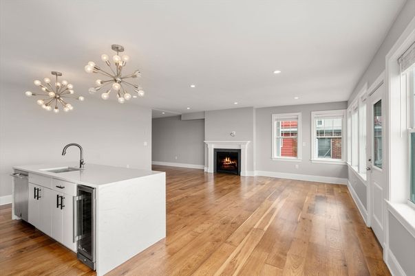 Empty room, Fireplace, Interior, Kitchen, Pendant Lights, Recessed Lighting, Wood Texture Flooring