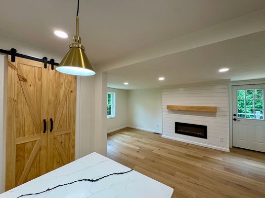 Empty room, Fireplace, Interior, Pendant Lights, Recessed Lighting, Wood Texture Flooring