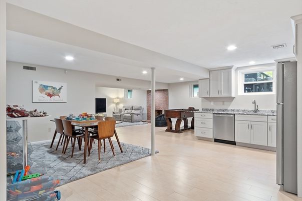 Dining room, Interior, Kitchen, Living room, Recessed Lighting, Stainless Steel Appliances, Stone Walls, Wood Texture Flooring