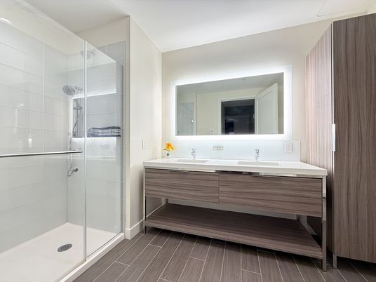 Bathroom, Dual Sink Vanities, Glass Shower, Interior, Wood Texture Flooring